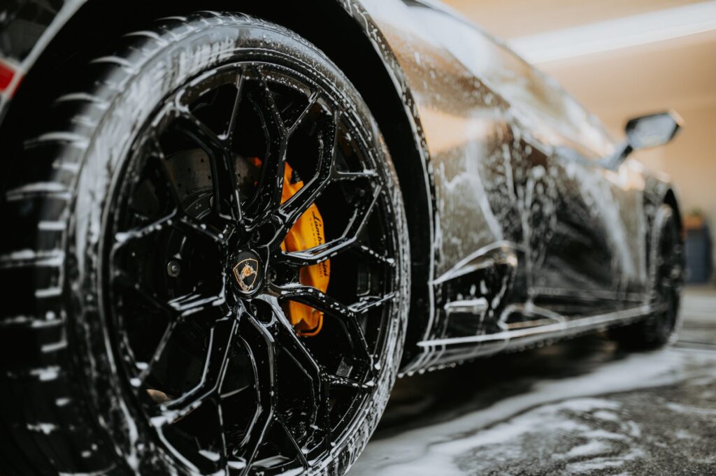 close up shot of a car wheel during car wash